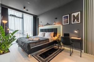 Posteľ alebo postele v izbe v ubytovaní Q18 ApartHotel