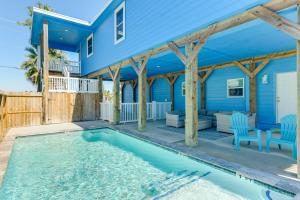 a house with a swimming pool in front of a house at Trendy Beach House with Private Pool and Deck! in Port Aransas