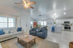 a living room with a couch and chairs and a table at Trendy Beach House with Private Pool and Deck! in Port Aransas