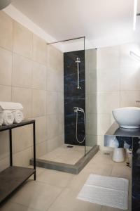 a bathroom with a shower and a sink at 3C’s Athens South @Delta: SNFCC / Faliro Seaview Penthouse in Athens
