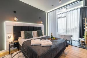 Posteľ alebo postele v izbe v ubytovaní Q18 ApartHotel