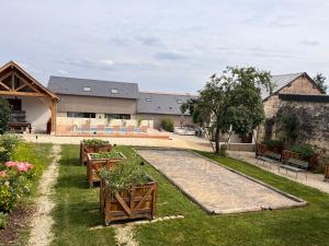 Vonkajšia záhrada v ubytovaní Maisons d'hôtes du Château au Grand Pressigny
