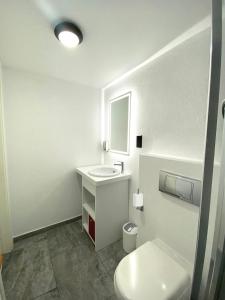 Koupelna v ubytování Citizen Suites