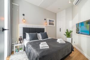 Posteľ alebo postele v izbe v ubytovaní Q18 ApartHotel
