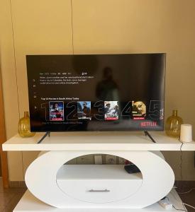 a flat screen tv sitting on top of a tv stand at Marble nights in Johannesburg