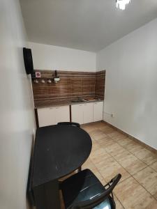 a room with a table and a desk and a chair at Dar Barka in Kebili