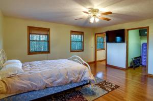 a bedroom with a bed and a ceiling fan at Byrdstown Apartment Less Than 4 Mi to Dale Hollow Lake! in Frogue