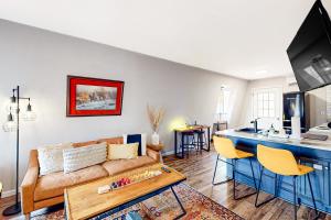 a living room with a couch and a counter top at The Haven in Hot Springs