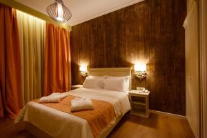 A bed or beds in a room at Irene's Resort