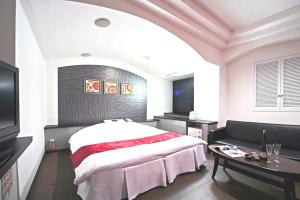 Postel nebo postele na pokoji v ubytování Hotel LALA minato