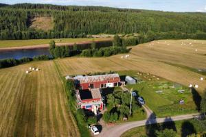 an aerial view of a house in the middle of a field at Ladans loft in Stöllet