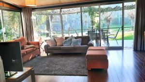 a living room with a couch and a table at Beautiful villa in Póvoa de Lanhoso with pool and garden in Póvoa de Lanhoso