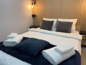 a bedroom with a large bed with towels on it at A piece of paradise in Puerto de la Cruz in Puerto de la Cruz