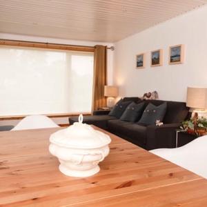 a living room with a table and a couch at Shamerbrea Design Townhouse in Inverness