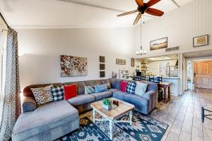 a living room with a couch and a table at Solar Serenity in Flagstaff