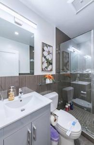 a bathroom with a toilet and a sink and a shower at 20 Guest Oasis - Spacious SF Skyline Getaway! in San Francisco