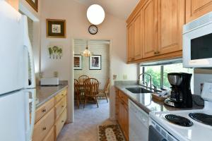 a kitchen with a sink and a stove top oven at Perfect Wine Country Retreat at Silverado in Napa +8 photos