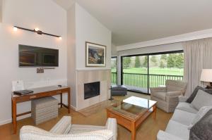 a living room with a couch and a fireplace at Wine Country Escape at Silverado in Napa! in Napa