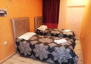 Postel nebo postele na pokoji v ubytování Hostel Ghali & Private Rooms Gueliz
