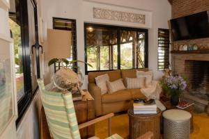 a living room with a couch and a fireplace at Rincones del Mogote 