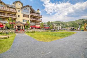 a large building with a park in front of it at Slopeside Retreat - Ski In Ski Out - Beaver Creek in Beaver Creek