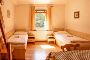 Postel nebo postele na pokoji v ubytování Pension Erban