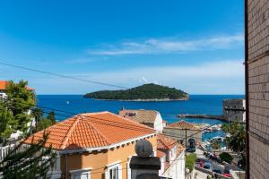 a view of a city and the ocean from a building at Guest House La Bohème in Dubrovnik