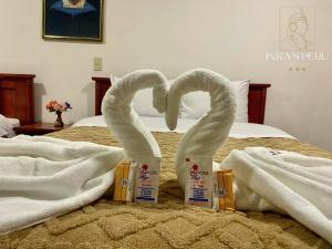 Postel nebo postele na pokoji v ubytování Inkas Peru Hostal