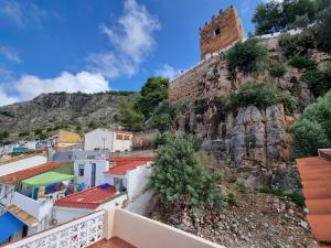 a view from the balcony of a town with a mountain at Casa Pagan in Cullera