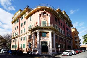 a large building on the corner of a street at La Casa Romana in Rome