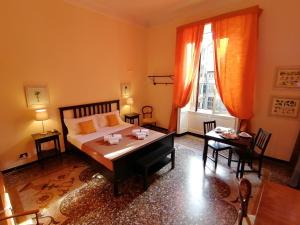 Postel nebo postele na pokoji v ubytování B&B Genova Centro