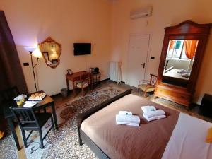 Postel nebo postele na pokoji v ubytování B&B Genova Centro