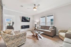 a living room with a couch and a table at 2 Bed Cozy Home, Dade City, Pickle Ball and Pool in Dade City