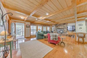 a living room with a couch and a table at Home Near Lincoln National Forest with Private Sauna in Cloudcroft