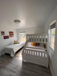 a bedroom with a bunk bed and a crib at Rancho Alegre. Bring your boat and RV too! in Clewiston