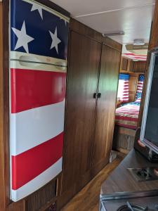 an american flag on the door of an rv at 'Arvey the American RV in Haxey