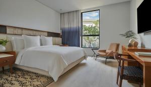 Postel nebo postele na pokoji v ubytování Four Seasons Resort Los Cabos