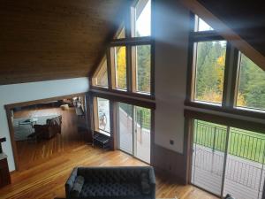 an overhead view of a living room with large windows at Ponderosa Glen @ Ashley Lake in Kila +76 photos