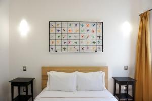 Postel nebo postele na pokoji v ubytování Hotel Pietro Santo