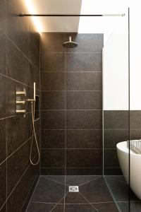 a bathroom with a shower and a sink at The Studio at The Grain Store in Falmer