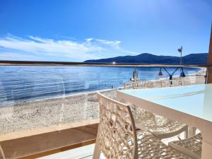 a view of the water from the balcony of a house at Getares Beach in Algeciras