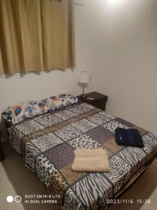 een slaapkamer met een bed met een kussen erop bij amir private apartment's in Tel Aviv