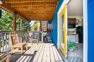 a porch with a wooden table and a wooden bench at Studio in West Seattle in Seattle
