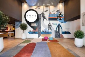 a lobby with a colorful rug on the floor at Rove Dubai Marina in Dubai