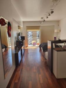 a room with a kitchen and a living room at Juncal Apartamento in Buenos Aires