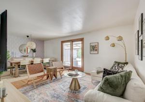 a living room with a couch and a table at Denver Hot Tub Retreat Near Downtown Denver-Stadiums-Bellco in Westminster