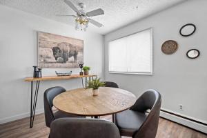 a dining room with a table and chairs at Modern 2BR with Free Parking and Newly Renovated in Fort McMurray