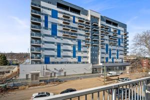 a tall building with blue and white at Modern 2BR with Free Parking and Newly Renovated in Fort McMurray
