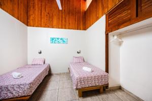 Postel nebo postele na pokoji v ubytování El Sueno Tropical