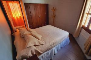 Postel nebo postele na pokoji v ubytování Acogedor departamento. + 6 fotografií